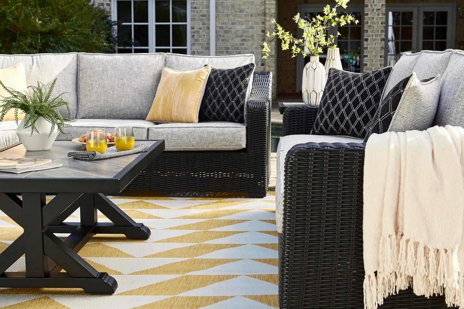 imageSignature Design by Ashley Beachcroft Casual Nuvella Weather Resistant Fabric 2Piece OutdoorIndoor Loveseat with Cushion and 4 Toss Pillows Black ampamp Light GrayGrey