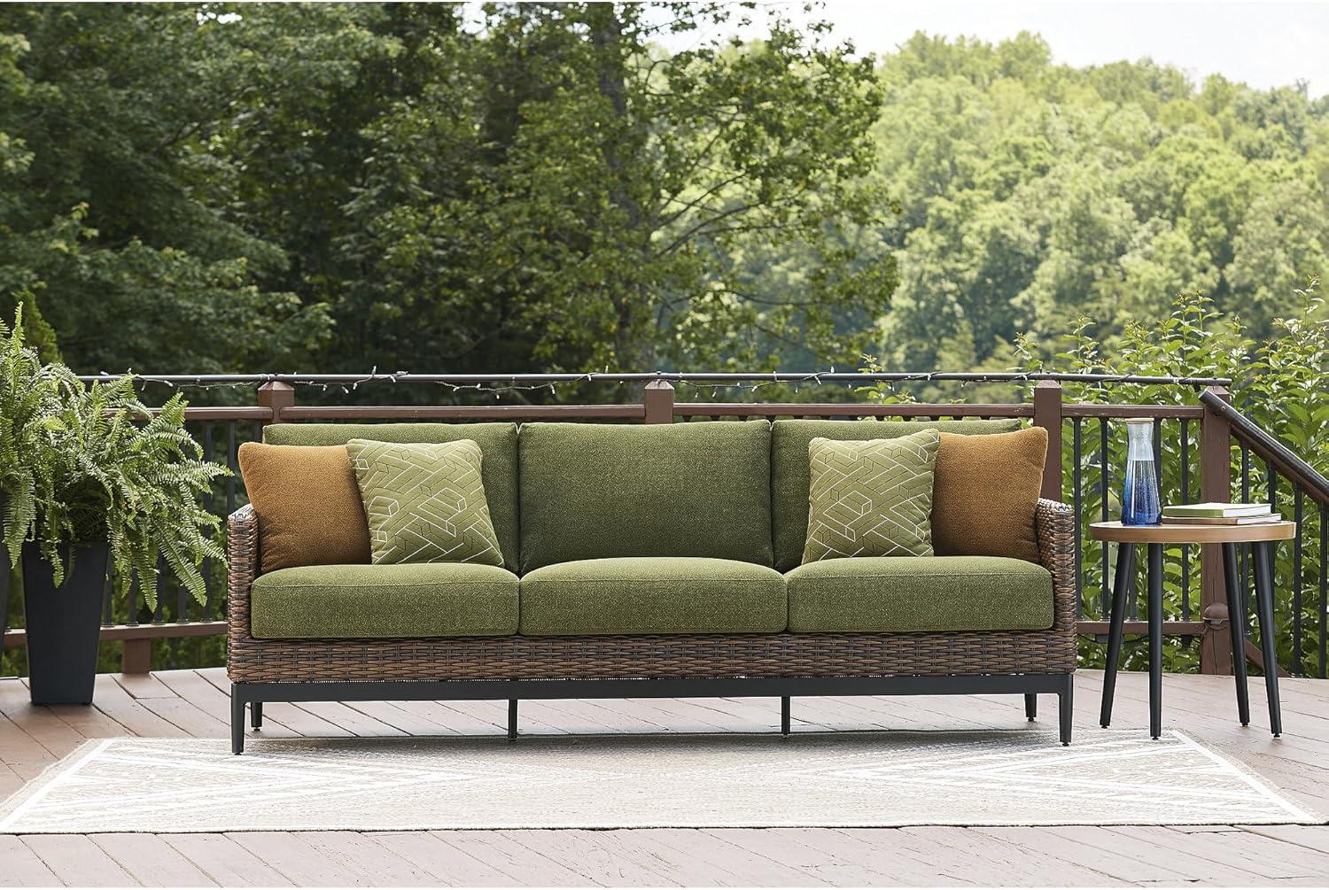 imageSignature Design by Ashley Horizon Hall Vintage Outdoor Nuvella Weather Resistant Fabric Resin Wicker Sofa with Cushion and 2 Accent Pillows Green ampamp Dark BrownOutdoor Sofa with Cushion