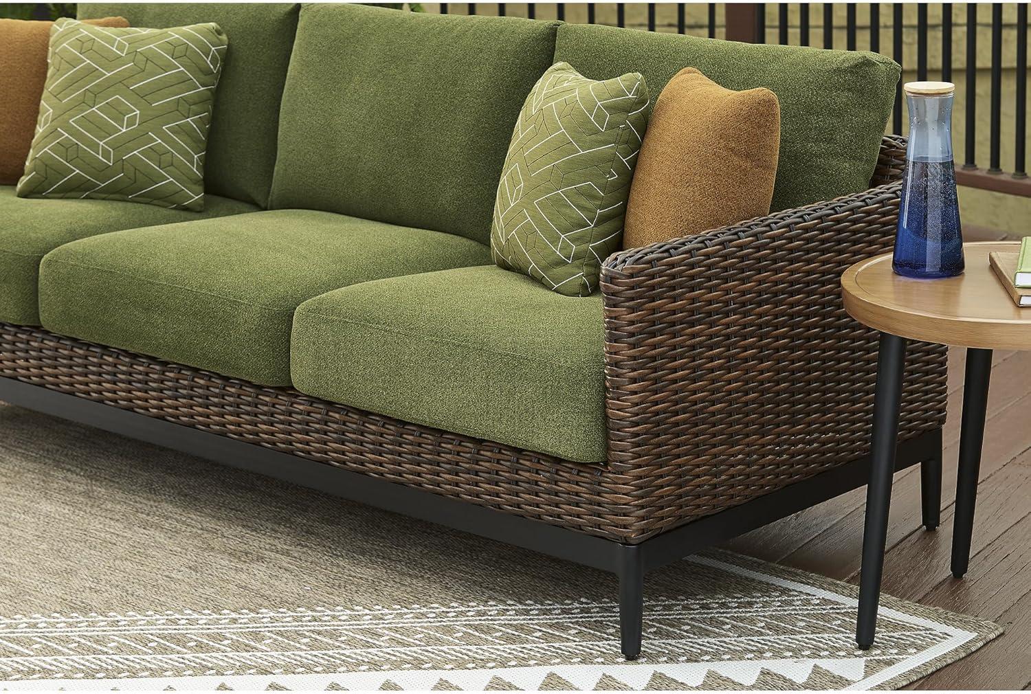 imageSignature Design by Ashley Horizon Hall Vintage Outdoor Nuvella Weather Resistant Fabric Resin Wicker Sofa with Cushion and 2 Accent Pillows Green ampamp Dark BrownOutdoor Sofa with Cushion