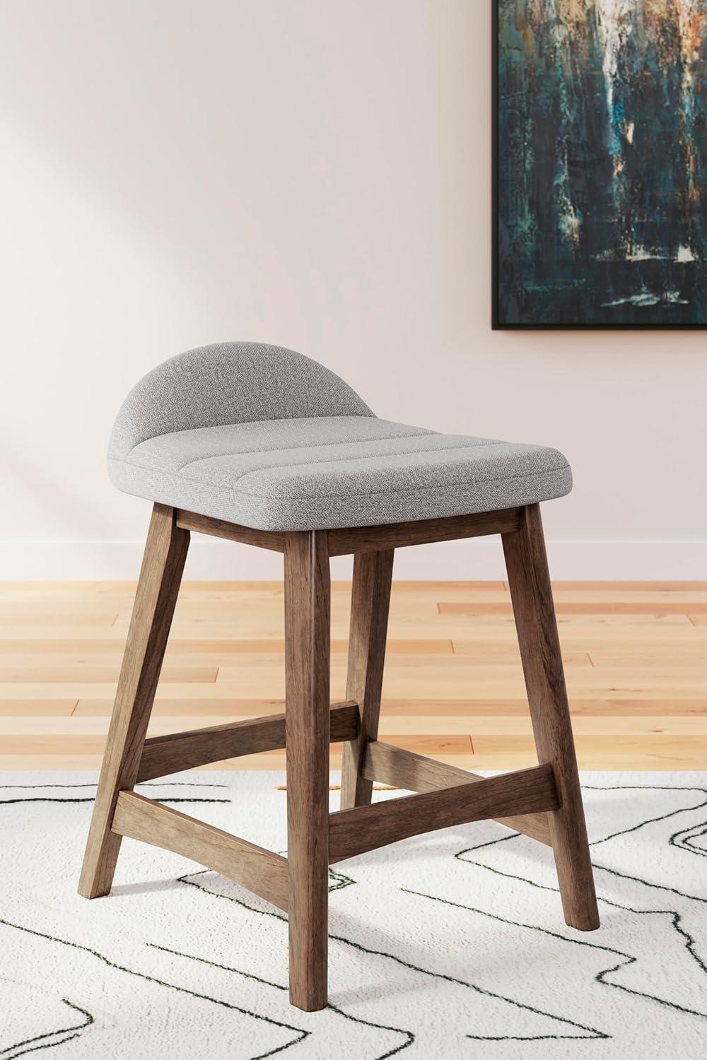 imageSignature Design by Ashley Lyncott Casual Counter Height Upholstered Bar Stool with Foam Cushion 2 Count 2425quot Seat Height Wood Frame Charcoal ampamp BrownLight Gray Brown