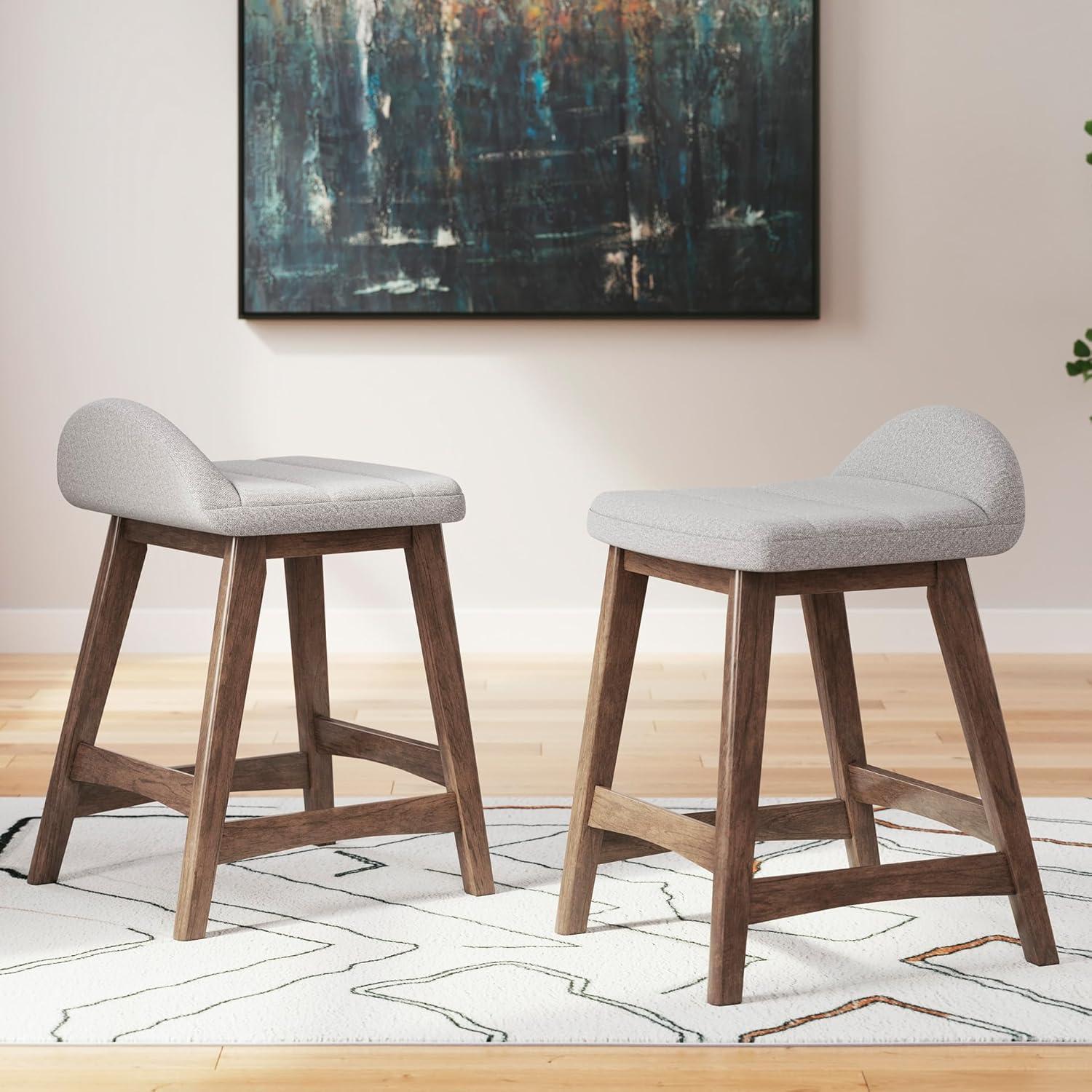 imageSignature Design by Ashley Lyncott Casual Counter Height Upholstered Bar Stool with Foam Cushion 2 Count 2425quot Seat Height Wood Frame Charcoal ampamp BrownLight Gray Brown