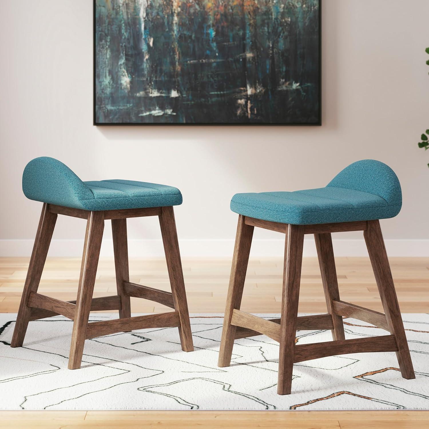 imageSignature Design by Ashley Lyncott Casual Counter Height Upholstered Bar Stool with Foam Cushion 2 Count 2425quot Seat Height Wood Frame Charcoal ampamp BrownBlue Brown