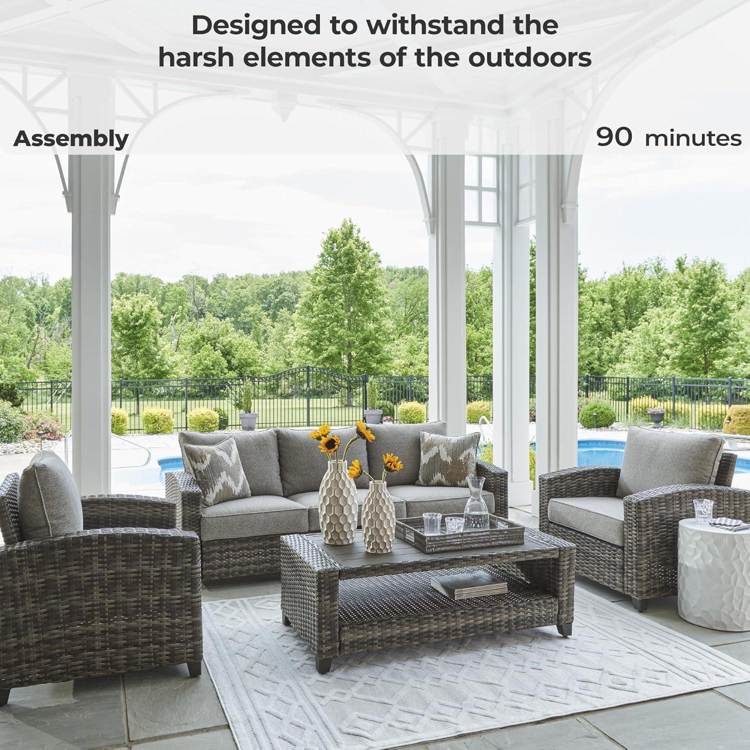 imageSignature Design by Ashley Oasis Court Casual Weather Resistant Cushioned Outdoor SofaChairsTable Set with 2 Throw Pillows Set of 4Nuvella Weather Resistant Fabric Gray