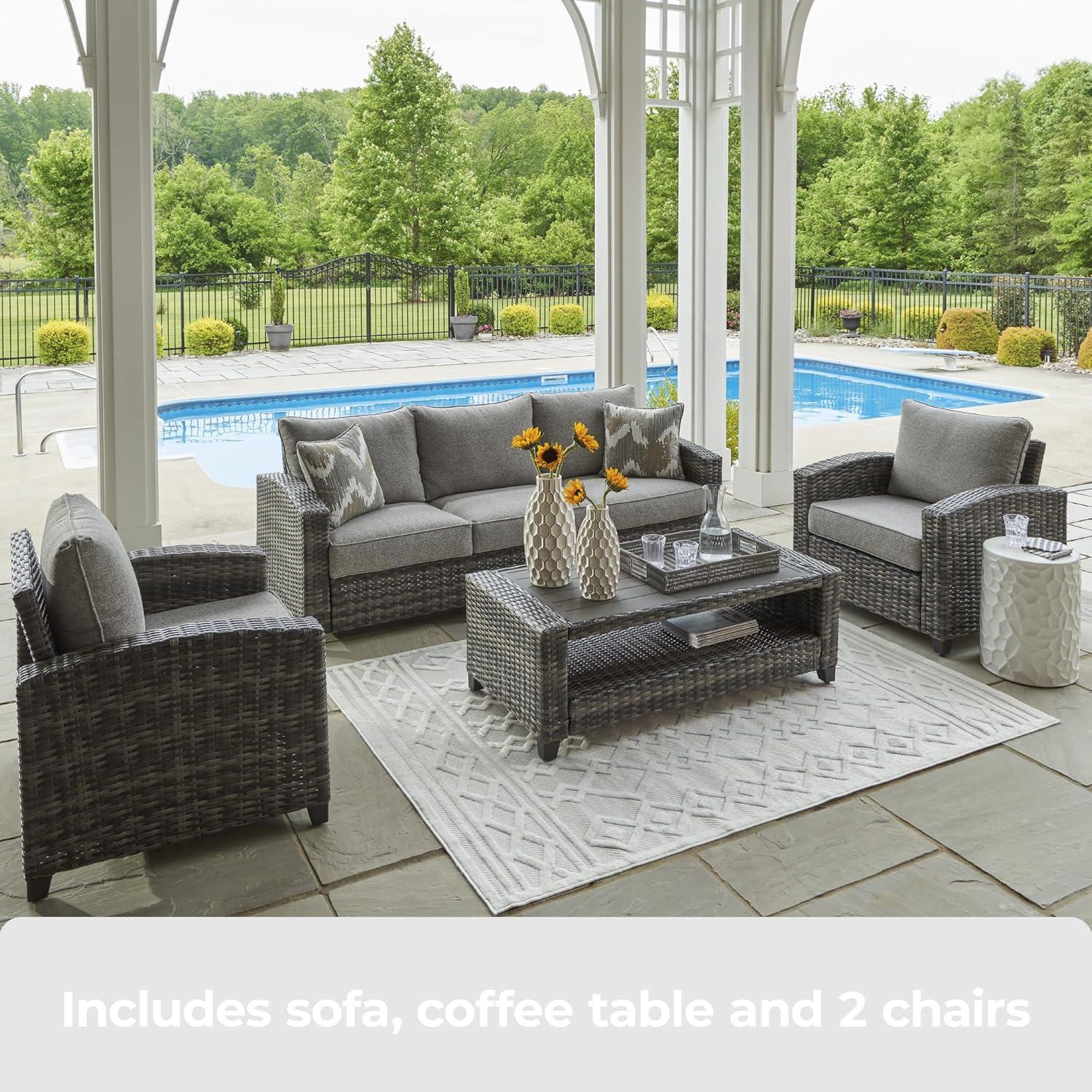 imageSignature Design by Ashley Oasis Court Casual Weather Resistant Cushioned Outdoor SofaChairsTable Set with 2 Throw Pillows Set of 4Nuvella Weather Resistant Fabric Gray
