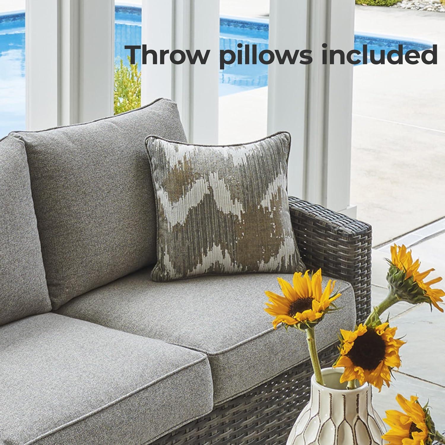 imageSignature Design by Ashley Oasis Court Casual Weather Resistant Cushioned Outdoor SofaChairsTable Set with 2 Throw Pillows Set of 4Nuvella Weather Resistant Fabric Gray