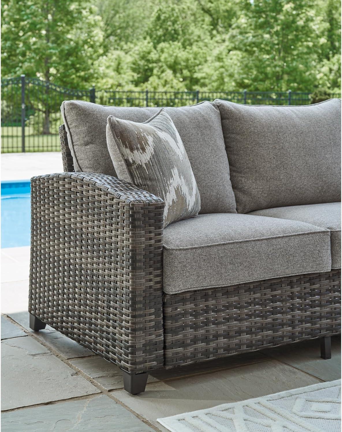 imageSignature Design by Ashley Oasis Court Casual Weather Resistant Cushioned Outdoor SofaChairsTable Set with 2 Throw Pillows Set of 4Nuvella Weather Resistant Fabric Gray
