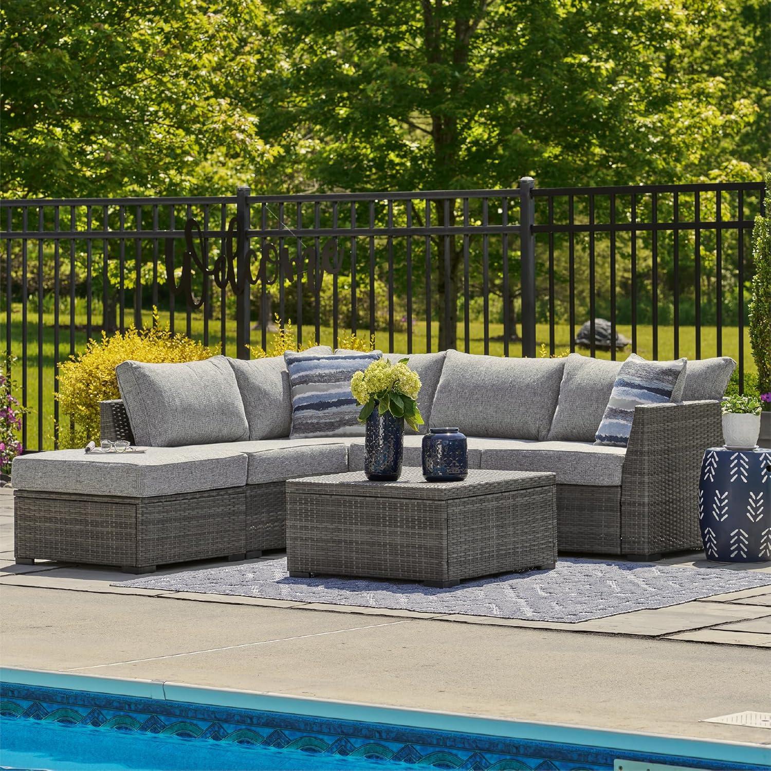 imageSignature Design by Ashley Petal Road Casual Nuvella Weather Resistant Fabric Cushioned Outdoor Loveseat SectionalOttomanTable Set with 2 Throw Pillows Set of 4 Gray