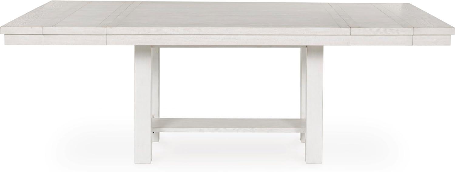 imageSignature Design by Ashley Robbinsdale Casual Removable Center Leaf Dining Extension Table with Trestle Base Wood Ash Veneer Tabletop with Planked Effect 2 Removable Center Leaves Seats 8 WhiteAntique White