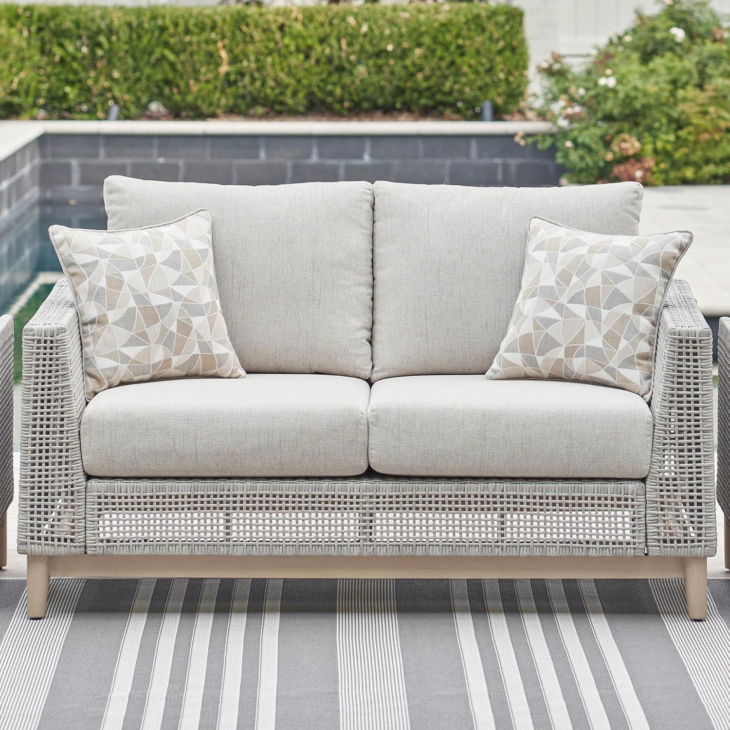 imageSignature Design by Ashley Seton Creek Cottage Nuvella Weather Resistant Fabric Outdoor Loveseat with Cushion and 2 Throw Pillows Light Brown ampamp Light GrayOutdoor Loveseat with Cushion