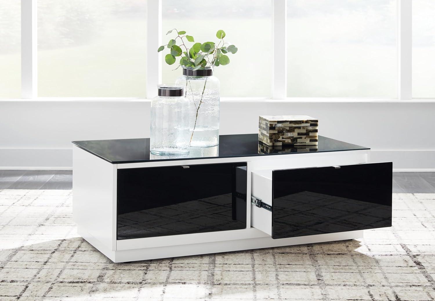 imageSignature Design by Ashley Gardoni Modern GlassTabletop Coffee Table with 2 Drawers Open Shelf Casters and High Gloss Finish White ampamp Black