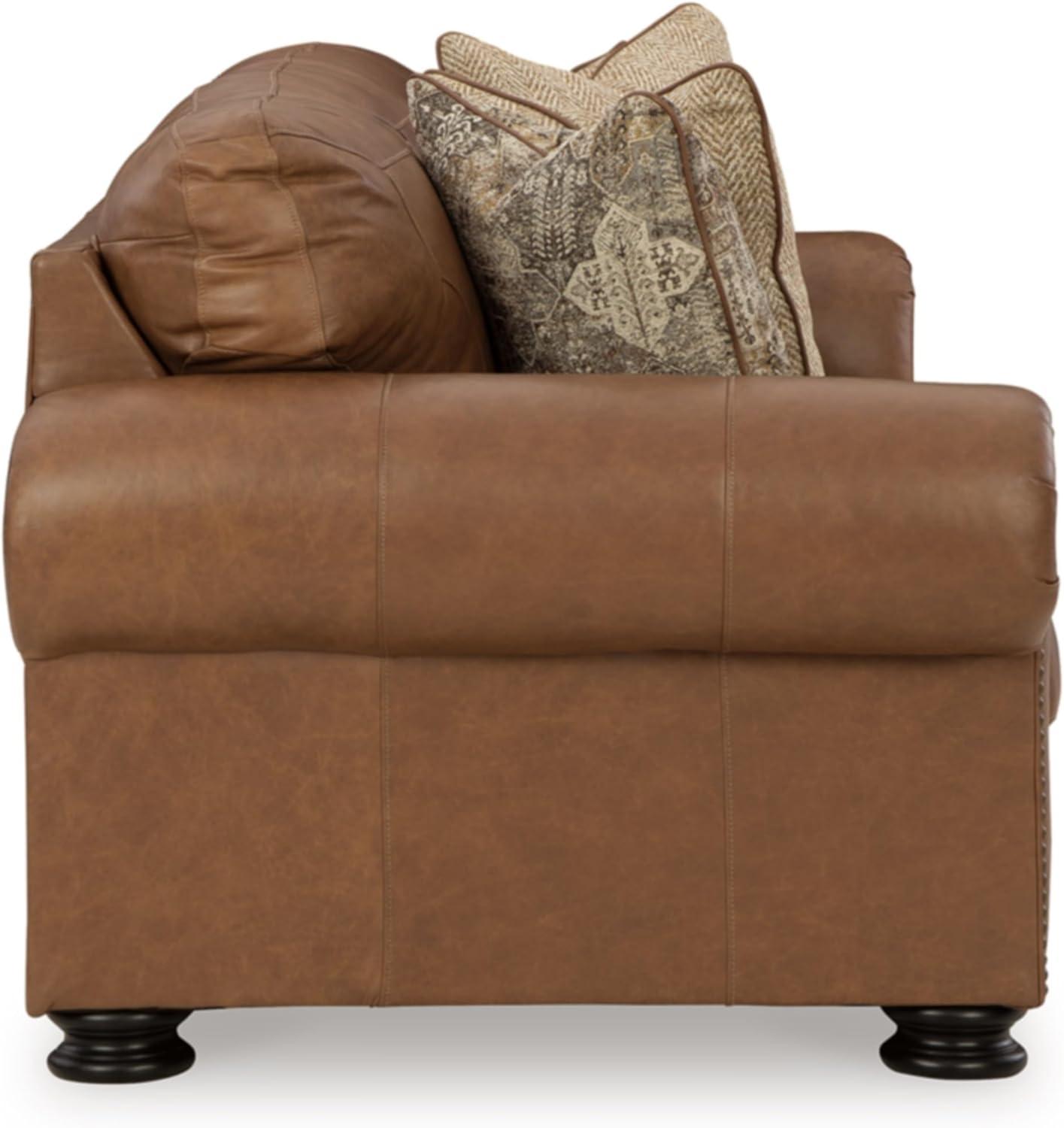 imageSignature Design by Ashley Shadsburne Rustic Faux Leather Sofa Sleeper with BiFold Memory Foam Mattress Nailhead Trim and 2 Throw Pillows Queen BrownDark Brown