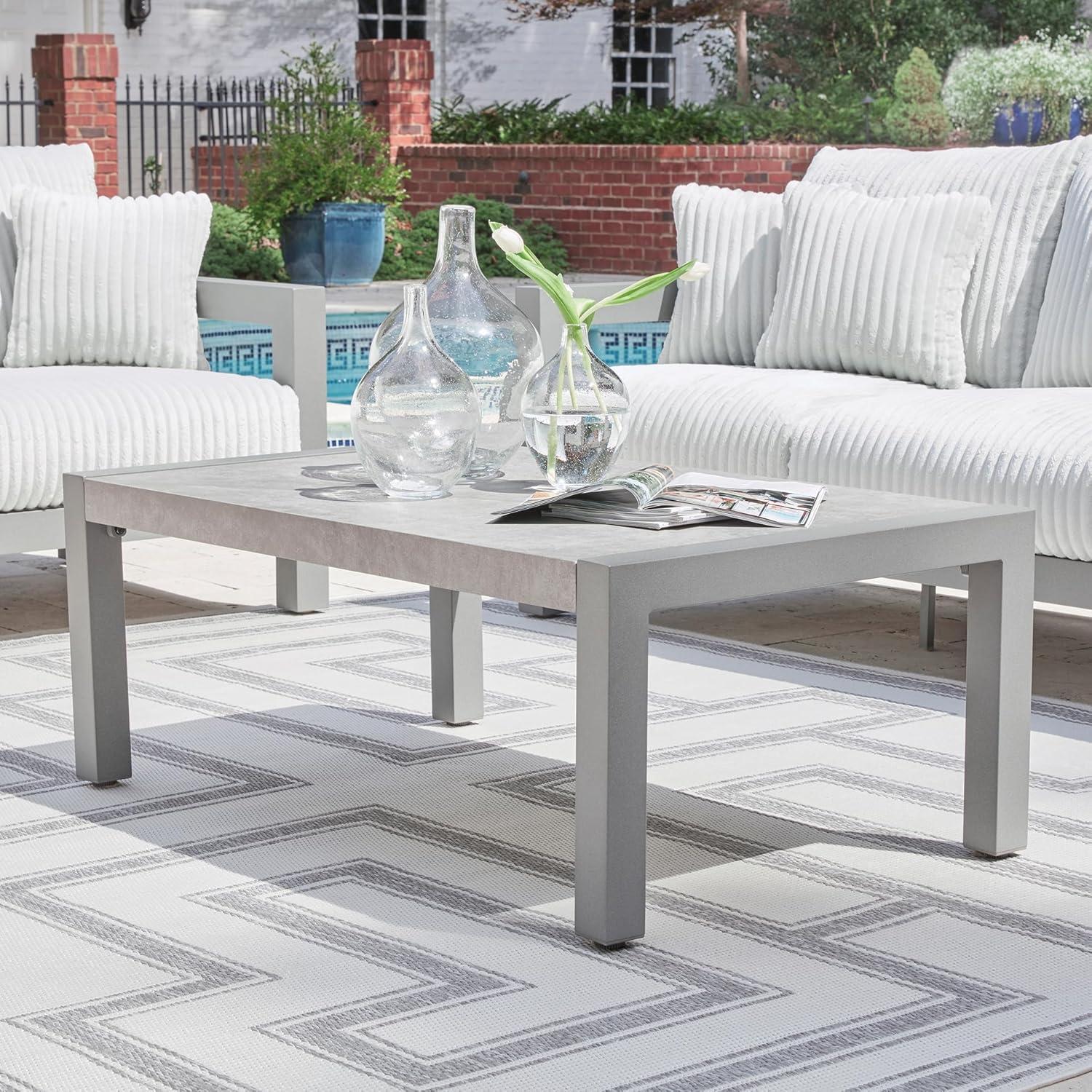 imageSignature Design by Ashley Moonlight View Contemporary Outdoor Fade and Rust Resistant Coffee Table with Stone Tabletop Light GrayOutdoor Coffee Table