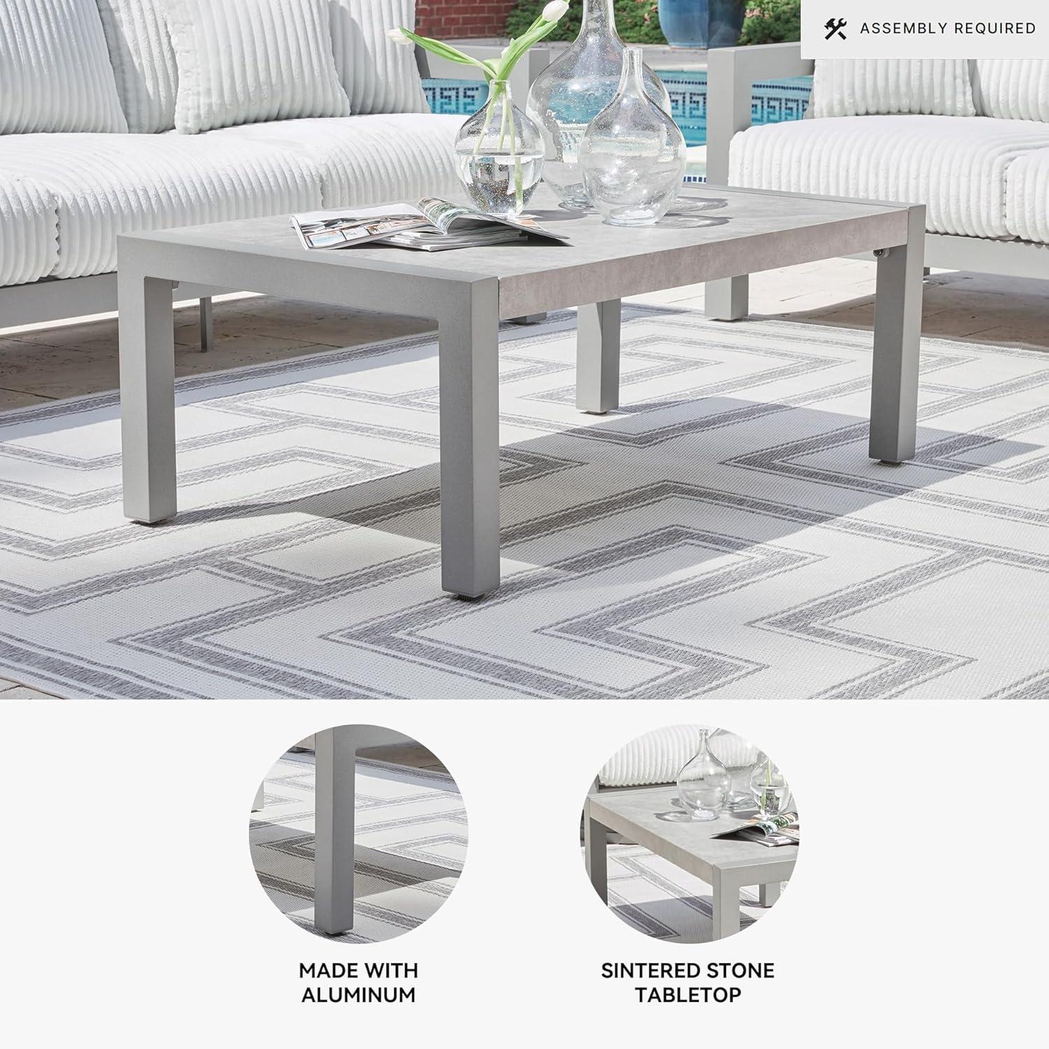 imageSignature Design by Ashley Moonlight View Contemporary Outdoor Fade and Rust Resistant Coffee Table with Stone Tabletop Light GrayOutdoor Coffee Table