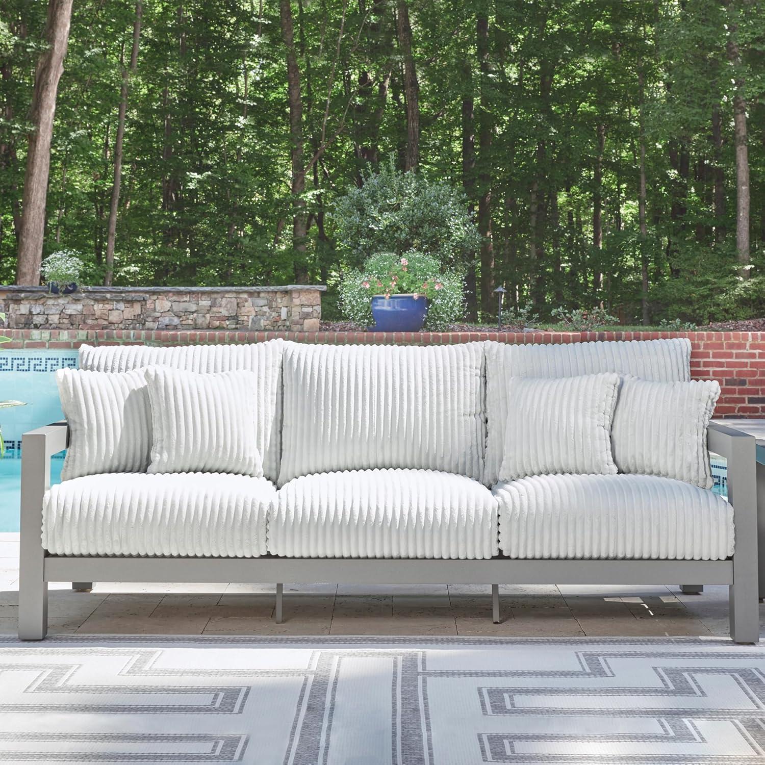 imageSignature Design by Ashley Moonlight View Contemporary Outdoor Fade and Rust Resistant Coffee Table with Stone Tabletop Light GrayOutdoor Sofa with Cushion