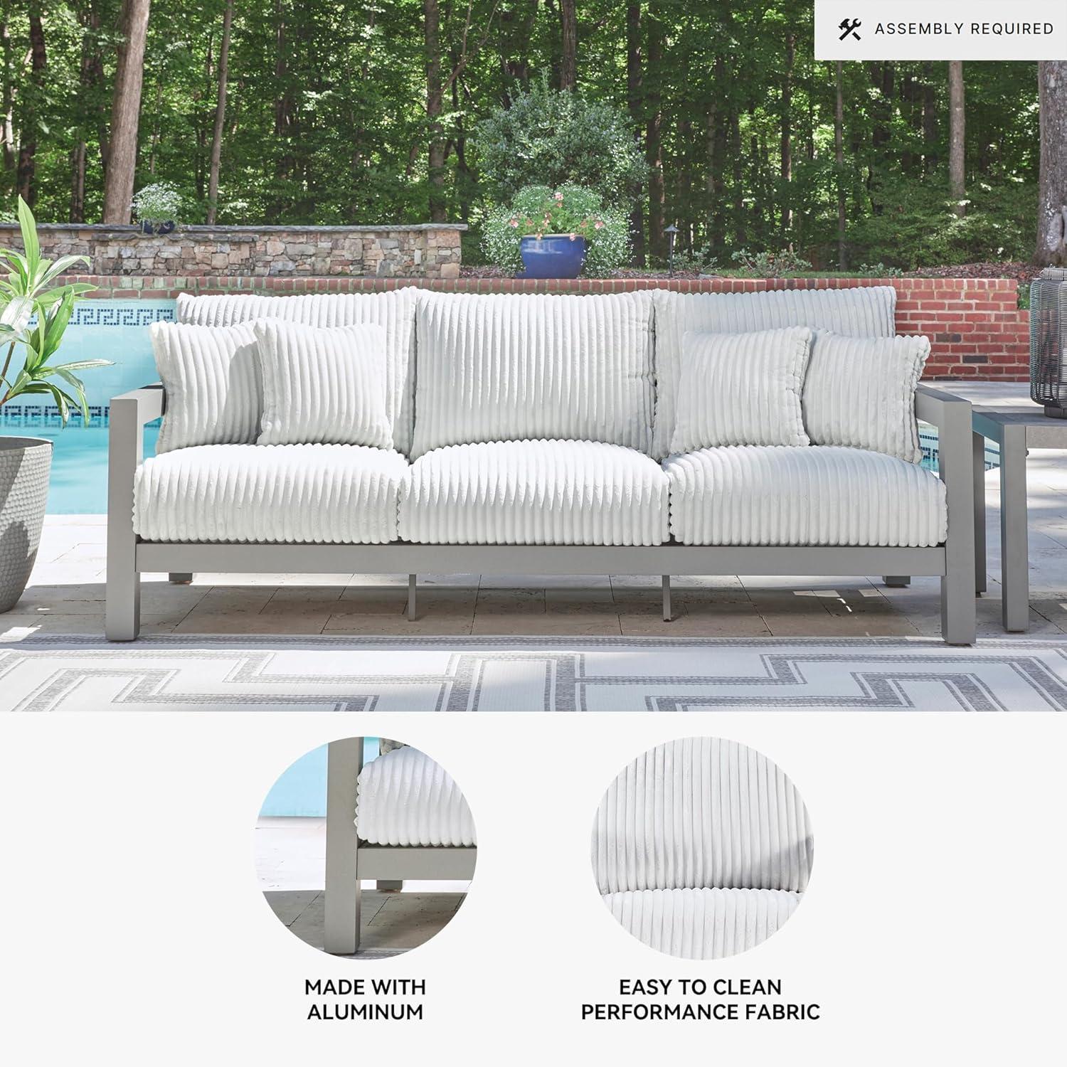 imageSignature Design by Ashley Moonlight View Contemporary Outdoor Fade and Rust Resistant Coffee Table with Stone Tabletop Light GrayOutdoor Sofa with Cushion