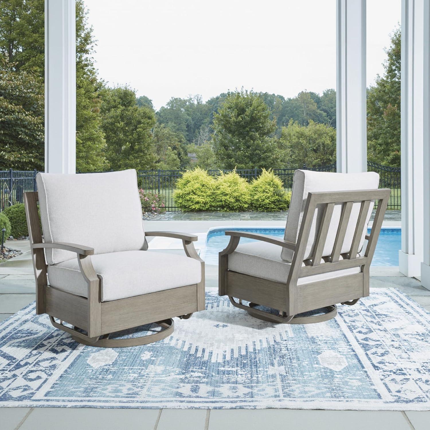 imageSignature Design by Ashley Rainier Ranch Contemporary Nuvella Weather Resistant Fabric Outdoor High Back Rocker Swivel Chair with Cushion Set of 2 Light Brown amp BeigeOutdoor Swivel Glider Chair with Cushion