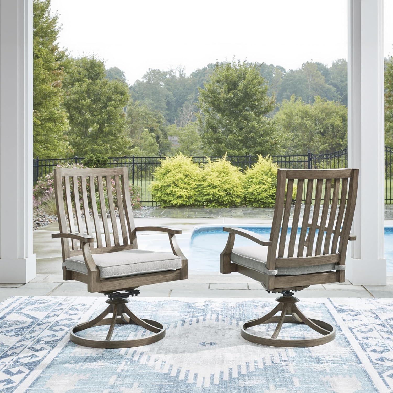 imageSignature Design by Ashley Rainier Ranch Contemporary Nuvella Weather Resistant Fabric Outdoor High Back Rocker Swivel Chair with Cushion Set of 2 Light Brown amp BeigeOutdoor Swivel Chair with Cushion Set of 2