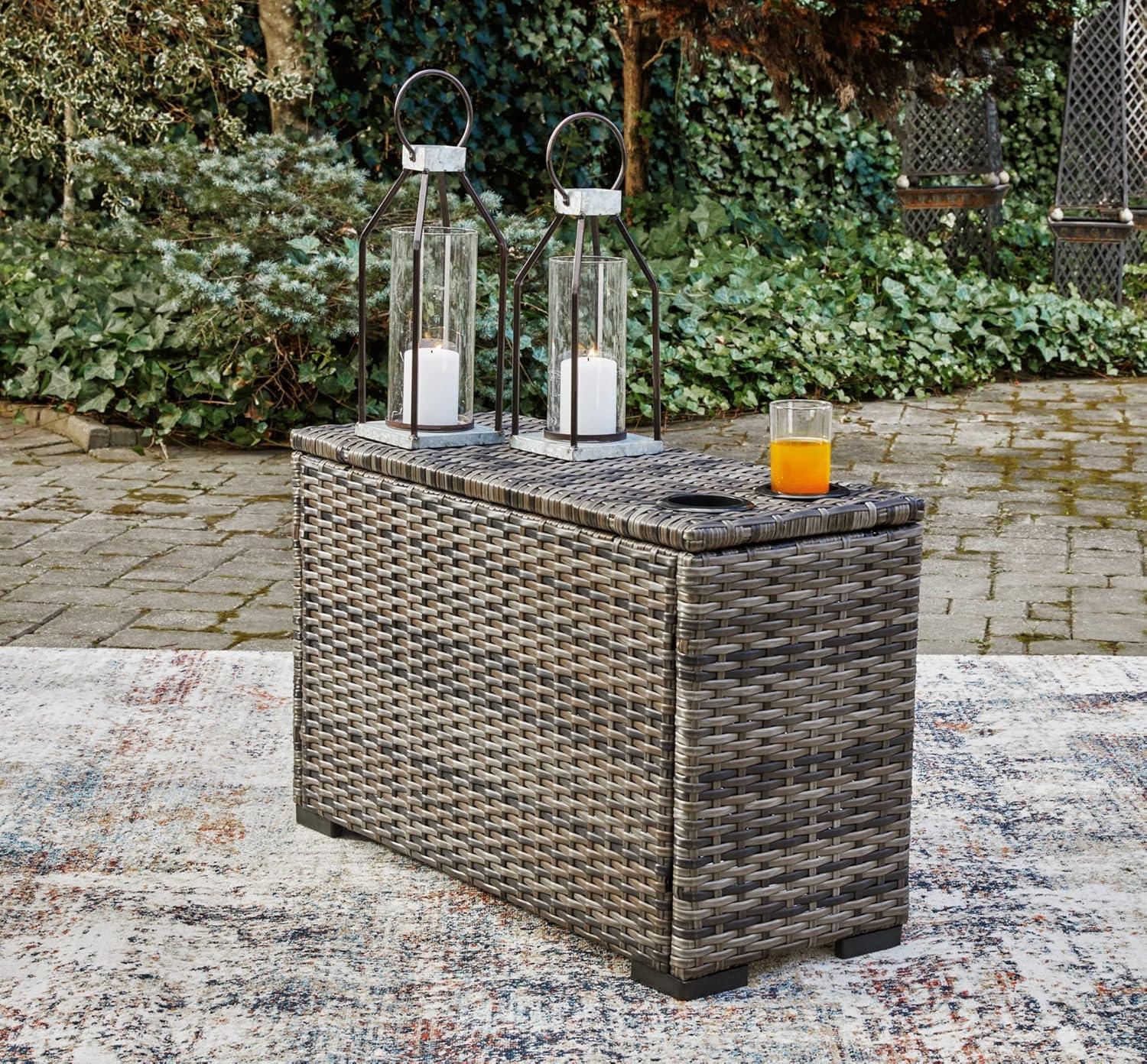imageSignature Design by Ashley Outdoor Harbor Court Patio Wicker Ottoman with CushionNuvella Weather Resistant Fabric GrayConsole