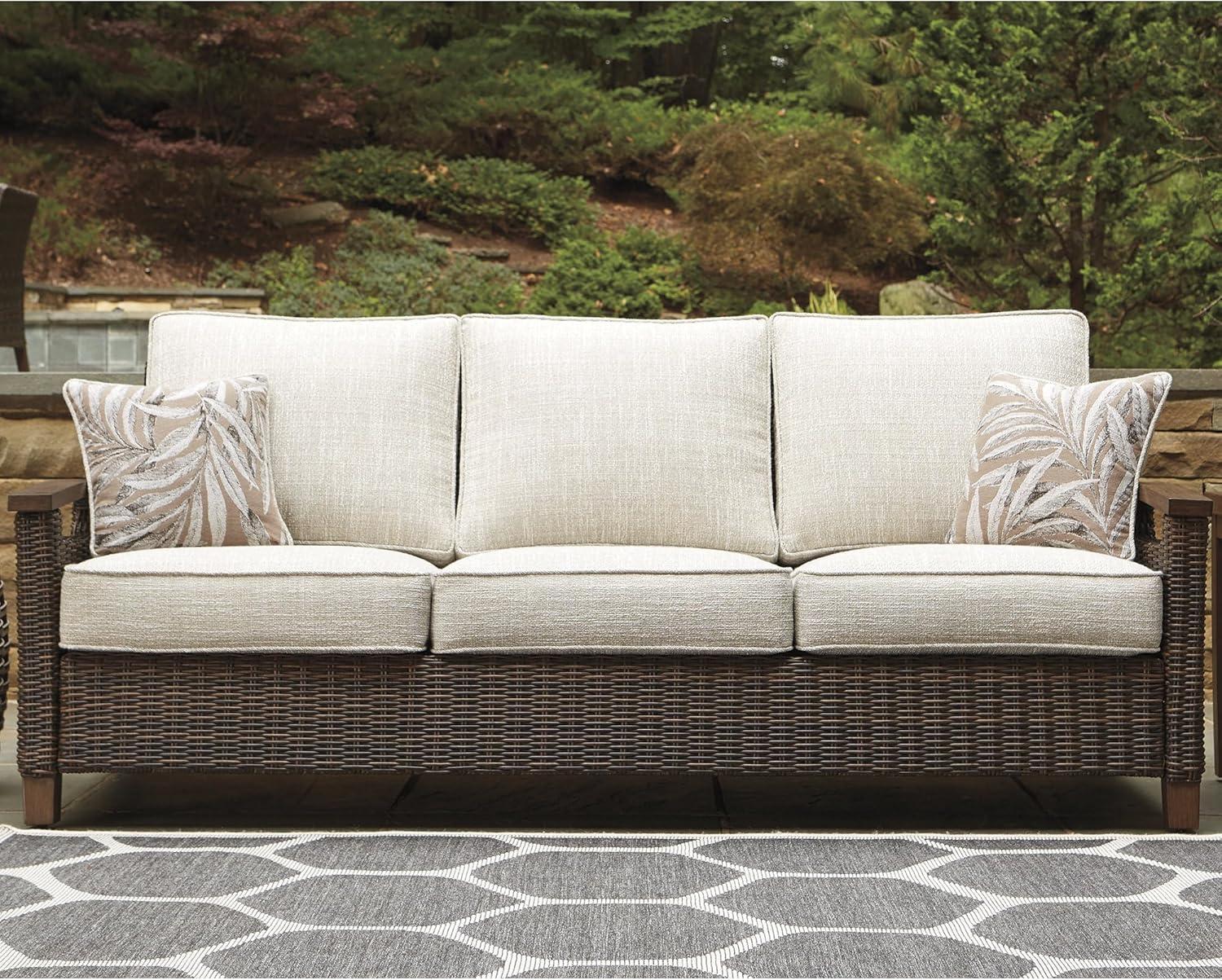 imageSignature Design by Ashley Paradise Trail Outdoor Loveseat with All Weather Cushions Nuvella Weather Resistant Fabric Medium BrownDark Brown