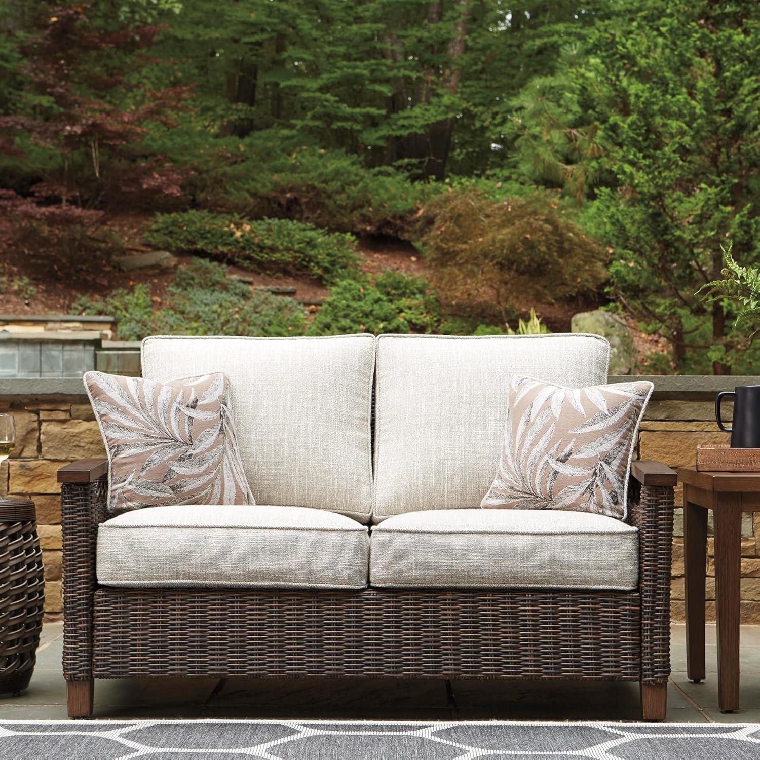 imageSignature Design by Ashley Paradise Trail Outdoor Loveseat with All Weather Cushions Nuvella Weather Resistant Fabric Medium BrownDark Brown