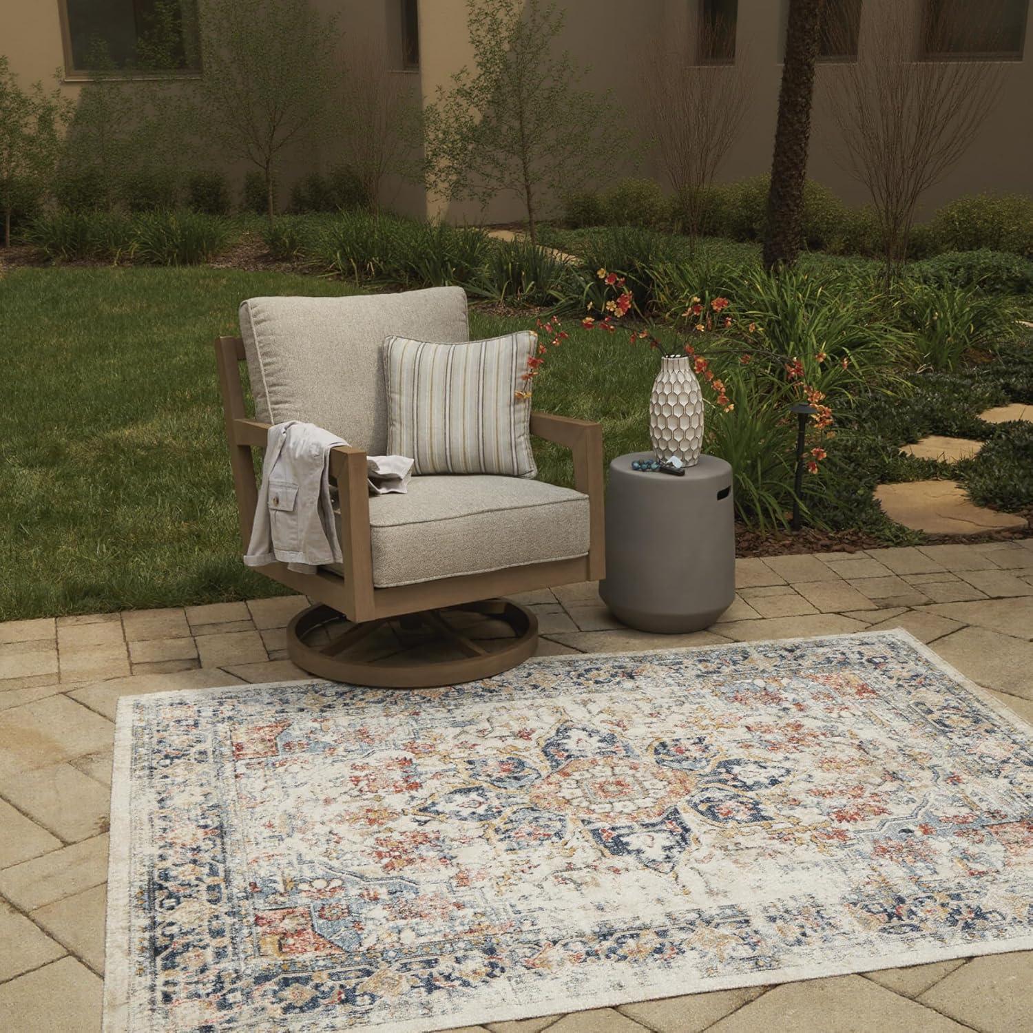 imageSignature Design by Ashley Jarrpage Classic IndoorOutdoor Medallion 5 x 7 Rug with Non Slip Backing Blue amp Orange
