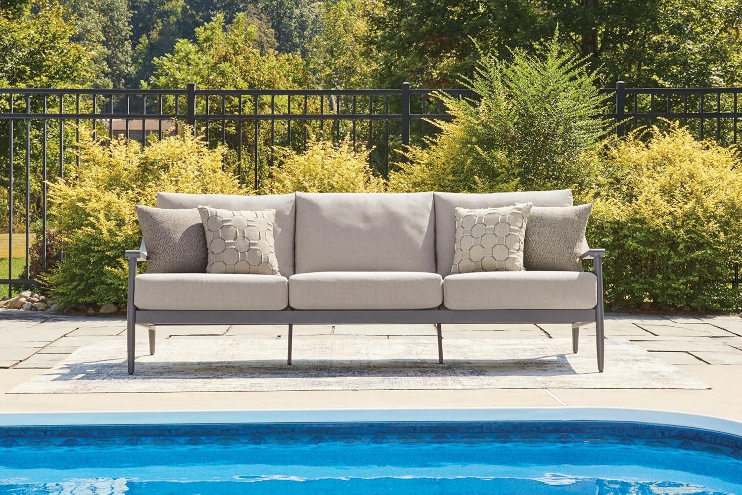 imageSignature Design by Ashley North Island Modern Nuvella Weather Resistant Outdoor Sofa with Cushion Sloped Arms and 4 Accent Pillows Gray