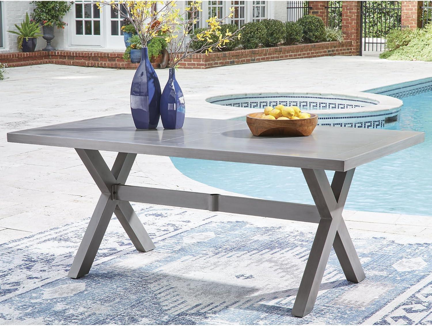 imageSignature Design by Ashley Dillon Beach Contemporary Outdoor Weather Resistant Dining Table with Umbrella Hole Light Gray