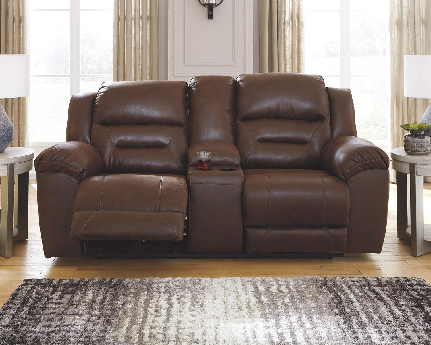 imageSignature Design by Ashley Stoneland Faux Leather Manual Double Reclining Loveseat with Center Console Dark BrownBrown