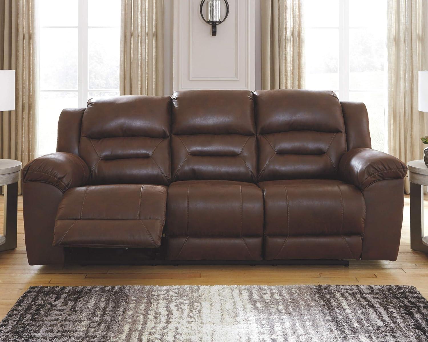 imageSignature Design by Ashley Stoneland Faux Leather Manual Double Reclining Loveseat with Center Console Dark BrownBrown
