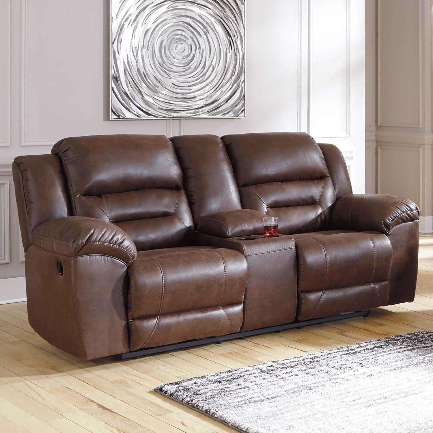imageSignature Design by Ashley Stoneland Faux Leather Manual Double Reclining Loveseat with Center Console Dark BrownBrown