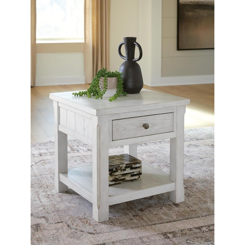 image:imageSignature Design by Ashley Farmhouse Square End Table Antique White Hardwood solids Ash veneer and MDF substrates Modern farmhouse style Living room use 1 drawer Robbinsdale Series