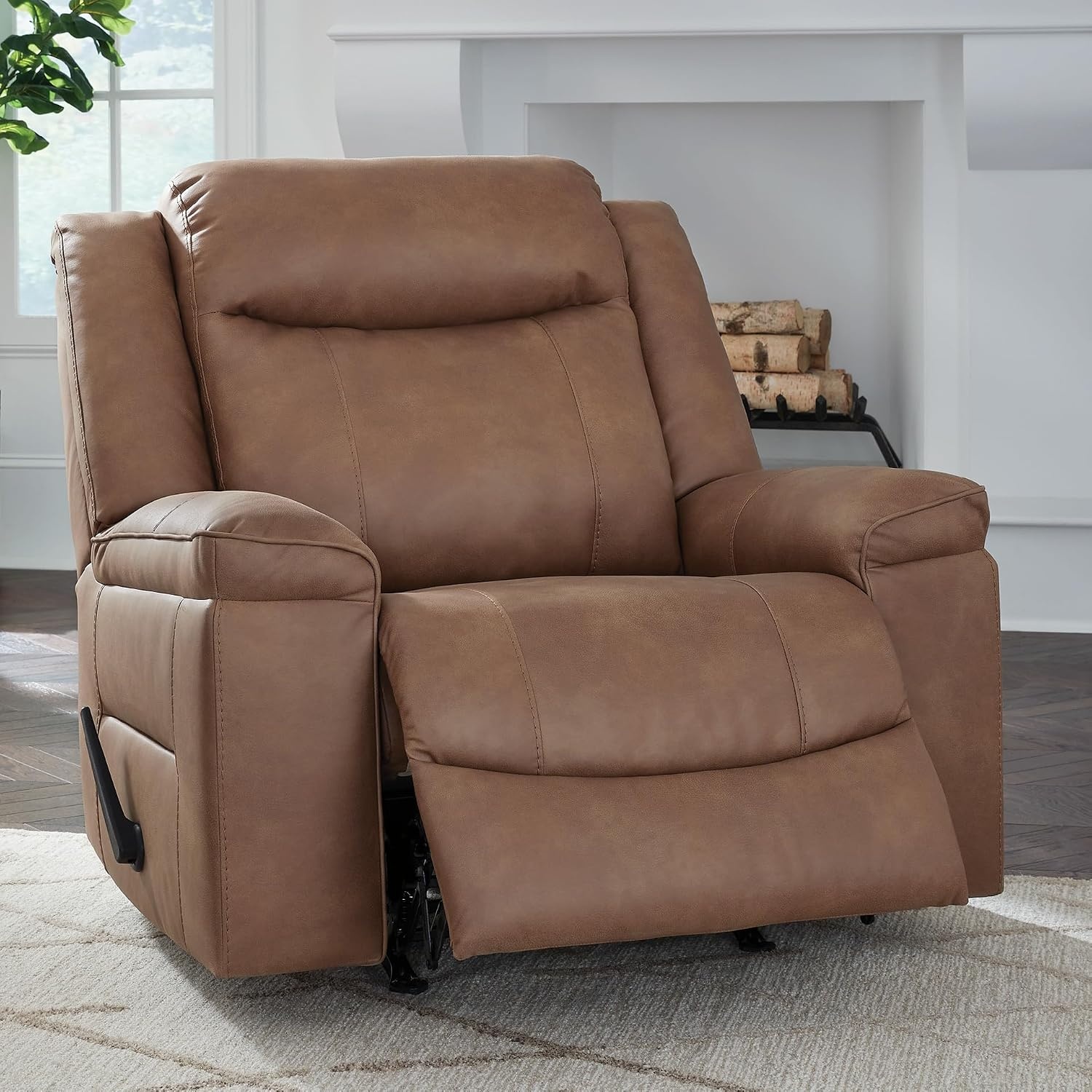 image:imageSignature Design by Ashley Oversized Manual Rocker Recliner Chair Shadow Faux leather upholstery 400 lbs weight capacity Living room use 44 in wide Steel seat box Chadstone SeriesCaramel